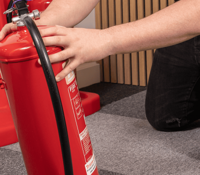 Fire Safety Services Carousel 2 Inspecting Fire Extinguisher